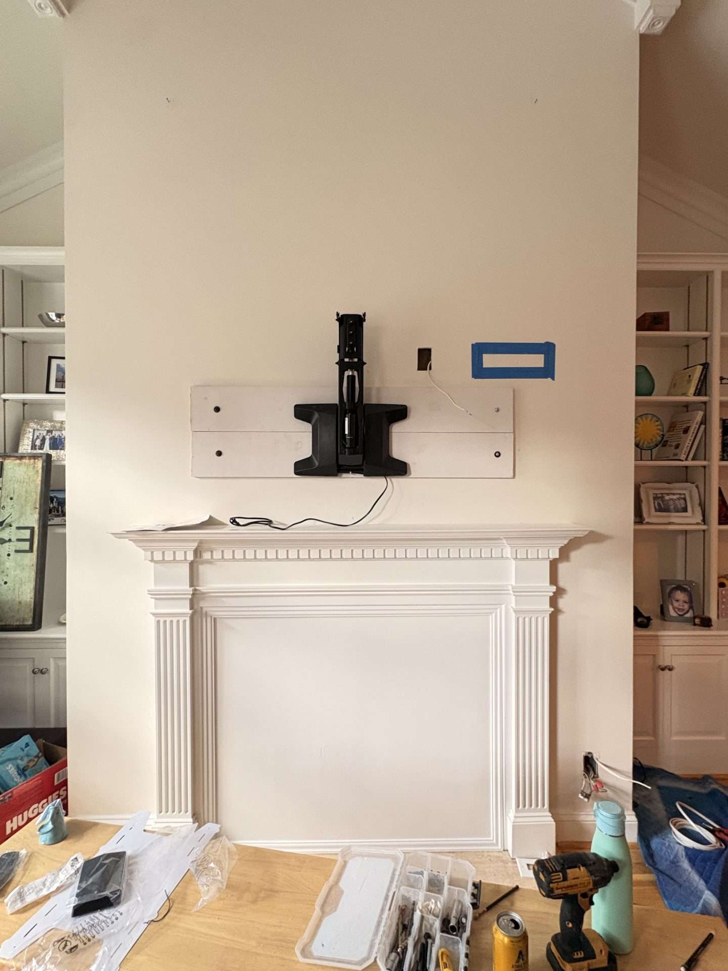 TV mounting bracket with custom backing over fireplace in Washington DC